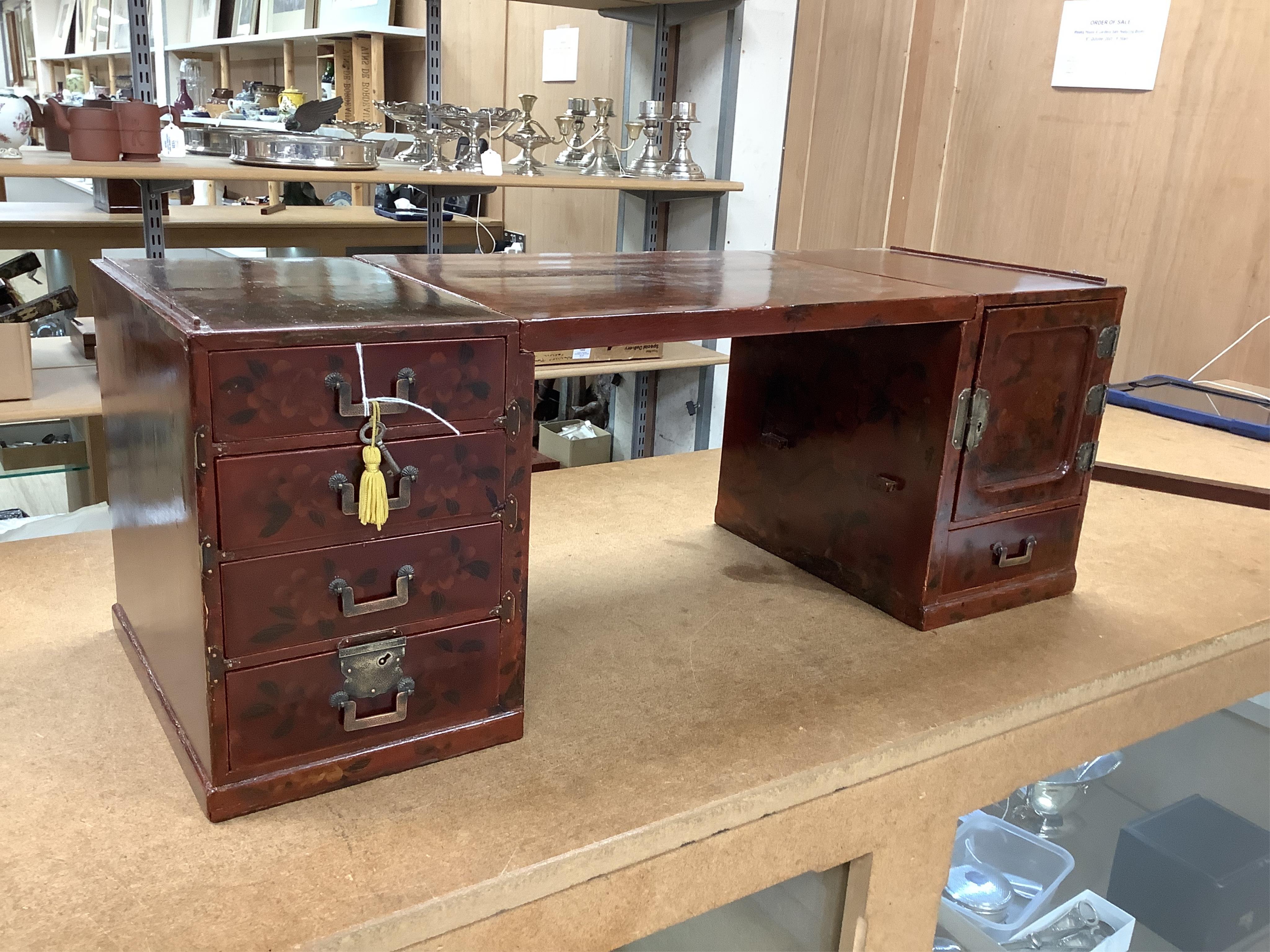 A Japanese floral lacquer table top cabinet, Taisho period, 36cm wide, the top panel is removable to form a twin pedestal cabinet